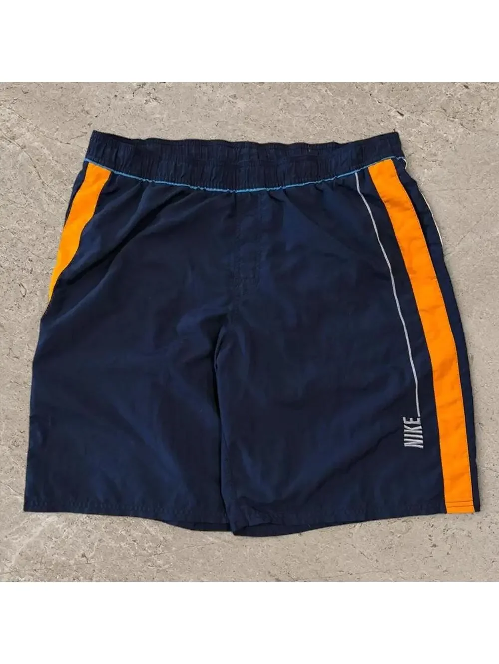 Super fire vintage early 2000s Nike grey tag swim trunks.